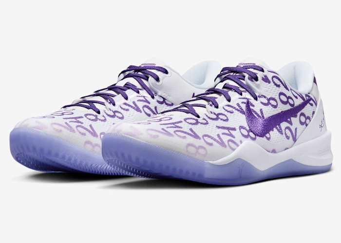 Side view of Kobe Bryant's white and purple Nike sneakers.
